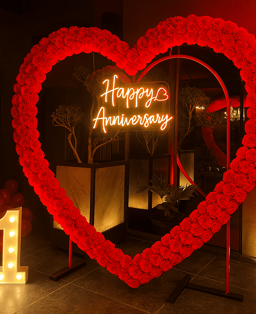 "Happy Anniversary celebration with beautiful heart shaped ring balloon decorations by Best Event Planner & Balloon Decorators, call 8595078930 for bookings."
